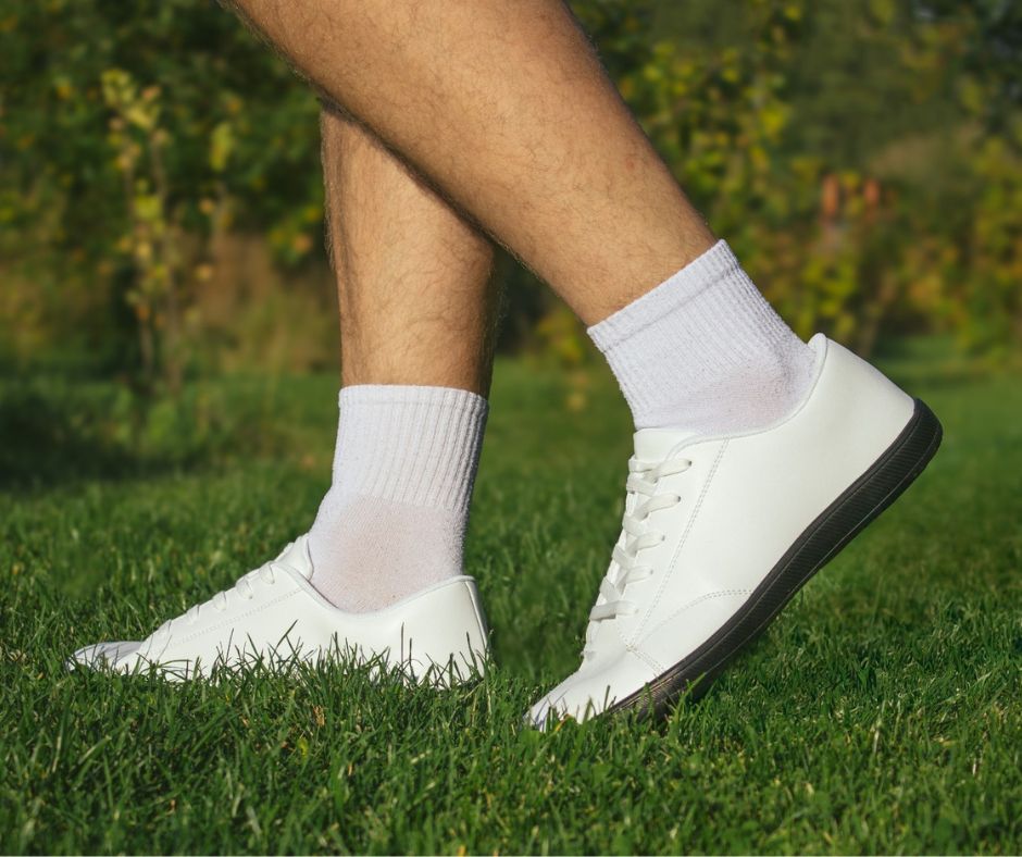 Grounded barefoot shoes on grass, grounding while walking outdoors